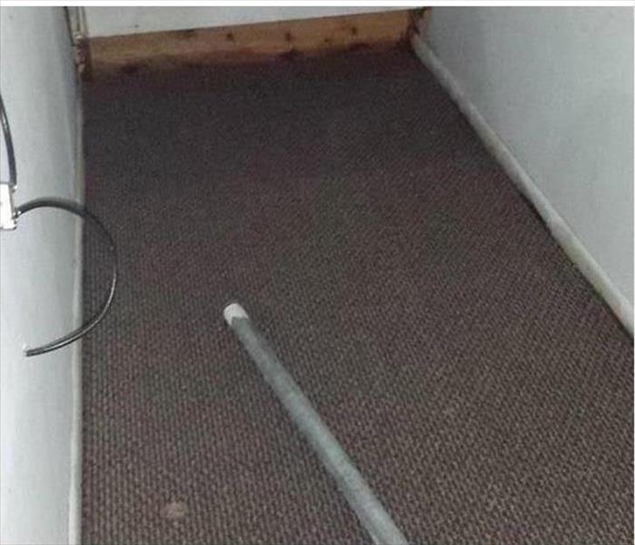 carpet wet, pipe,under stairs, water stained walls
