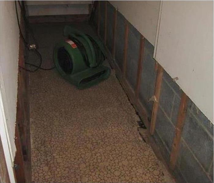 flood cuts, fir strips visible, carpet pulled out