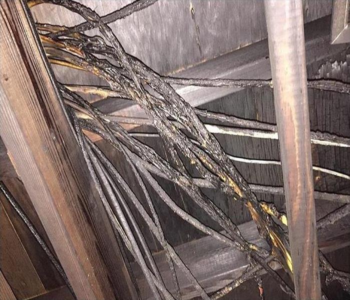 charred wiring in attic and lumber