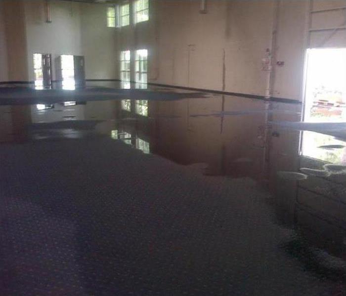 flooded carpet in large commercial building, bay windows