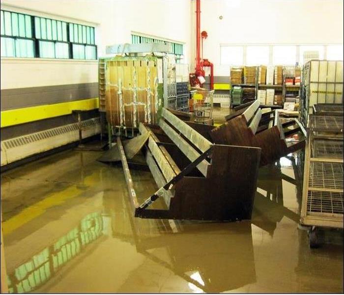 dirty floodwater in mail room, twisted racks.